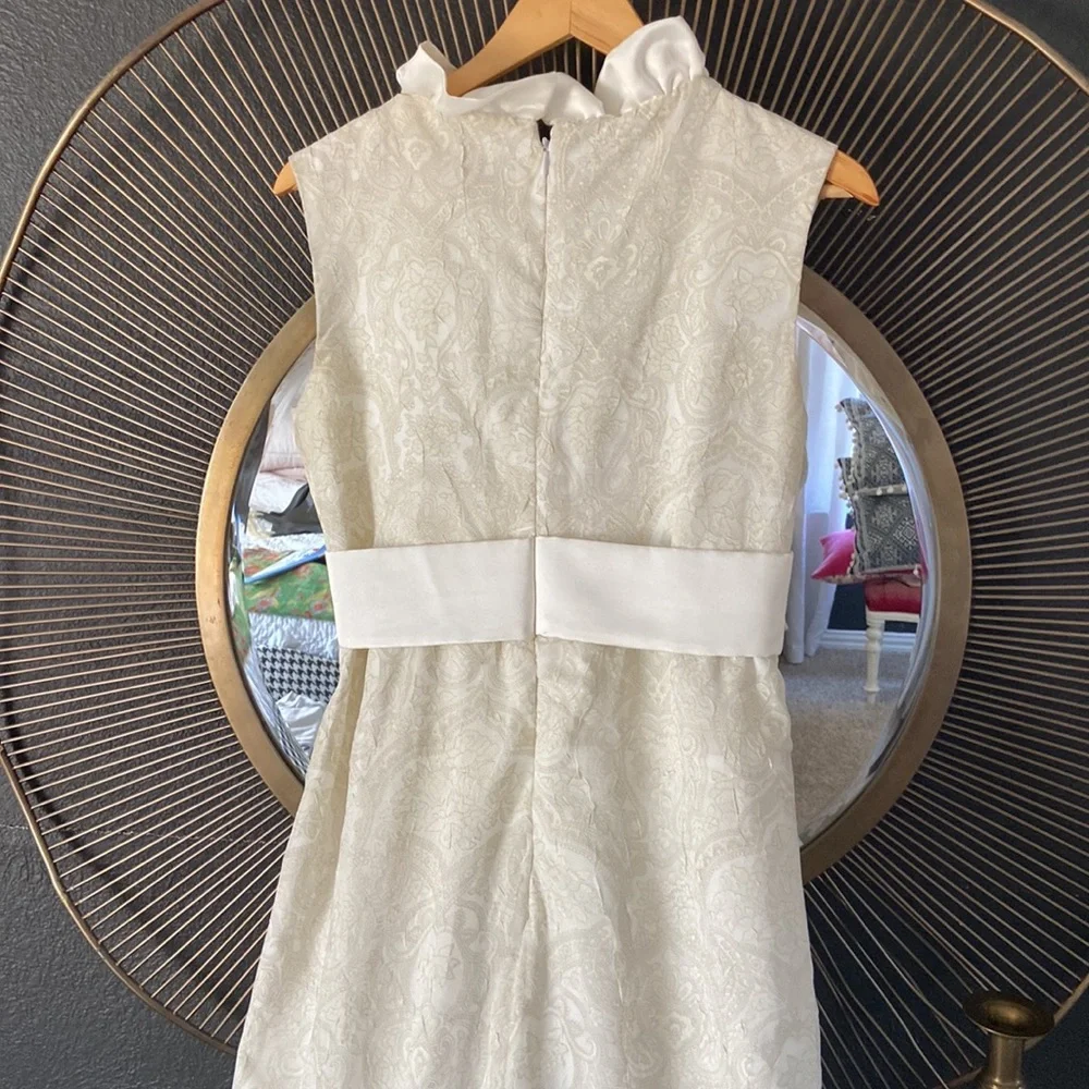 Custom made ivory tone on tone sleeveless dress with satin ruffle and bow. - Picture 6 of 7